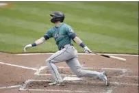  ?? AP photo ?? The Mariners’ Mitch Haniger follows through on a two-run homer in the fifth inning of the first game of a doublehead­er against the Orioles on Thursday.