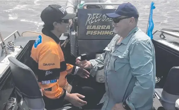  ?? Picture: REEL SCREAMIN’ BARRA FISHING CHARTER ?? Kevin “Pudd” Edwards proposes to Harn Newton on a Reel Screamin’ Barra Fishing Charter boat at Shady Camp