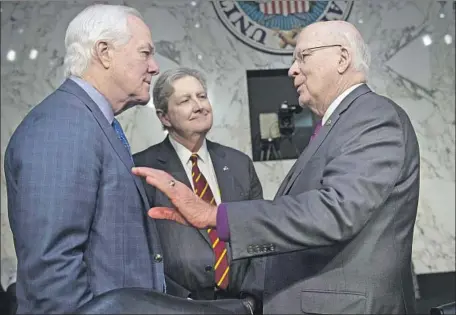  ?? Caroline Brehman CQ-Roll Call ?? GOP SENS. John Cornyn, left, and John Kennedy talk with Democratic Sen. Patrick J. Leahy, right, before a 2019 hearing on FISA abuses.