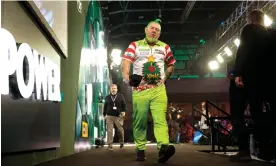  ?? Williams. Photograph: Tom Jenkins/The Guardian ?? Peter Wright was dressed for the occasion but found little festive cheer in defeat to Jim