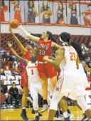  ?? Richard Brian Las Vegas Review-journal ?? UNLV’S Alyssa Anderson (20) and Syracuse’s Gabrielle Cooper battle for a rebound in the Lady Rebels’ Duel in the Desert loss at Cox Pavilion.