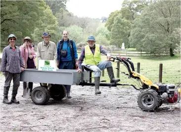  ??  ?? Friend of Mount Worth State Park volunteers utilising the benefits of the Fonterra Grass Roots Fund (from left) Merrin Strickland, Andrea Fisher, Ron Carey, Tony Castle and Paul Strickland (on mower).