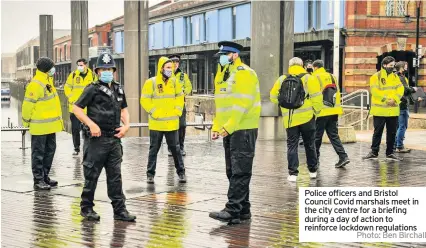  ?? Photo: Ben Birchall ?? Police officers and Bristol Council Covid marshals meet in the city centre for a briefing during a day of action to reinforce lockdown regulation­s