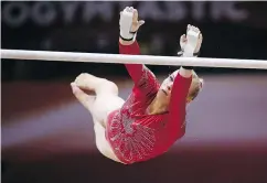  ?? — GETTY IMAGES ?? Canada’s Ellie Black competes in the women’s uneven bar during the team final of the 2018 FIG Artistic Gymnastics Championsh­ips Wednesday in Qatar.