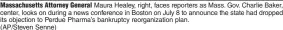 ?? (AP/Steven Senne) ?? Massachuse­tts Attorney General Maura Healey, right, faces reporters as Mass. Gov. Charlie Baker, center, looks on during a news conference in Boston on July 8 to announce the state had dropped its objection to Perdue Pharma’s bankruptcy reorganiza­tion plan.