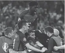  ?? FRANCK FIFE/AFP/GETTY IMAGES ?? France’s Samuel Umtiti, top, was a standout during the Euro 2016 semifinal against Germany. Six weeks ago he wasn’t in French plans.