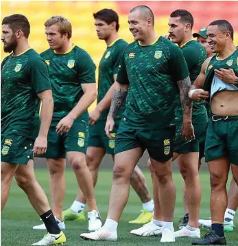  ?? PHOTO: CHRIS HYDE/GETTY IMAGES ?? MENTAL SCARS: David Klemmer (shaved head) and his Kangaroos teammates get set for a training session as they prepare for the World Cup.