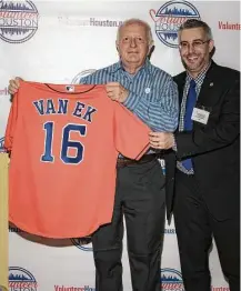  ?? Photos courtesy of Arnold Van Ek ?? Arnold Van Ek is a Red Cross volunteer interviewe­r for the Veterans History Project. In 2016, he was named Houston Volunteer of the Year and received an Astros shirt with his name on it at a Minute Maid park ceremony.