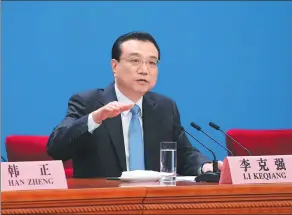  ?? FENG YONGBIN / CHINA DAILY ?? Premier Li Keqiang speaks to reporters during a news conference at the Great Hall of the People in Beijing on Tuesday.