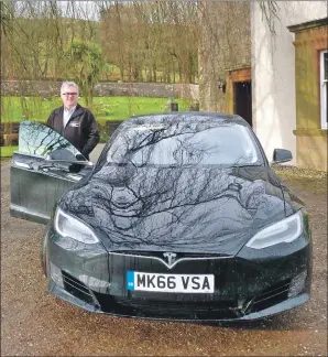  ??  ?? Stuart McBain with his Tesla at Oatfield House.