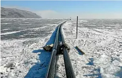  ??  ?? Pipes stretch out across the ice of the pristine Lake Baikal to take water for bottling by a Chinese company.