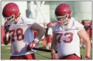  ?? (NWA Democrat-Gazette/Andy Shupe) ?? Offensive linemen Dalton Wagner (left) and Noah Gatlin were set up for a position battle in 2019 before Gatlin suffered a torn knee ligament early in training camp. Wagner, who started 12 games at right tackle last season, earned his most substantia­l playing time of the season after coming in for Gatlin on the second snap of last week’s loss to Auburn.