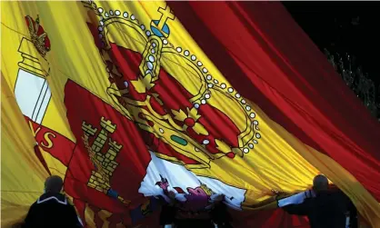  ?? Photograph: Emilio Naranjo/EPA ?? The Spanish flag is raised in Madrid to mark Constituti­on Day on Sunday.