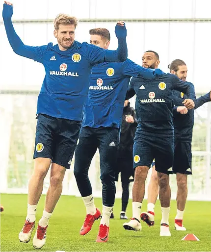  ?? Pictures: SNS Group. ?? Clockwise, from above: Stuart Armstrong leads the squad in a warm-up exercise at Oriam yesterday; Scott McTominay, who is expected to make his debut against Costa Rica on Friday; Scotland boss Alex McLeish listens to coach James McFadden; Jack Hendry...