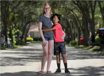  ?? Mike Stocker/Sun Sentinel/TNS ?? Emily Lieber, 14, and her brother Liam, 13, ran into a problem when using Uber. When the driver showed up, he told the teens they were too young. So Emily did what any resourcefu­l teen would do: She hailed another Uber.