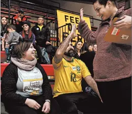  ?? TAMIR KALIFA/THE NEW YORK TIMES ?? Vanessa Marcano-Kelly, left, a volunteer for the presidenti­al campaign of Sen. Bernie Sanders, attends an organizing event Jan. 18 at East High School in Des Moines, Iowa.