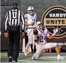  ?? AP PHOTO/MARK HUMPHREY ?? Kentucky running back Chris Rodriguez Jr. (24) celebrates after scoring a touchdown against Vanderbilt on Saturday.