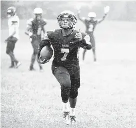  ?? KIM HAIRSTON/BALTIMORE SUN ?? Parkville’s Lamontte Brown sprints into the end zone after making an intercepti­on in the second quarter. The Knights’ Vernon Miller also had a pick-six in the first half.