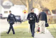  ?? ?? Police investigat­e cases of stabbings in Rockford, Illinois, U.S., March 27, 2024.