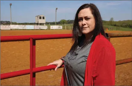  ?? (Special to the Democrat-Gazette/Dwain Hebda) ?? Danielle Smith stands just outside Smith Arena in Rose Bud, where she watched as her 14-year-old son, Brander Smith, was killed in an accident last summer while practicing for a national roping competitio­n. Danielle first considered selling it before embracing the arena as holy ground and starting the nonprofit Brander’d by Christ in his memory.