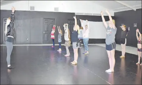  ?? RACHEL DICKERSON/ MCDONALD COUNTY PRESS ?? Kara Sandlin, left, leads an acrobatics class in exercises at her studio, Kara’s Kicks Dance Alliance in Anderson.