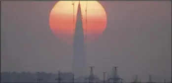  ?? ASSOCIATED PRESS ?? The Lakhta Centre tower under constructi­on, the headquarte­rs of Russian gas monopoly Gazprom, is silhouette­d against the sunset in St. Petersburg, Russia, on April 15, 2018.