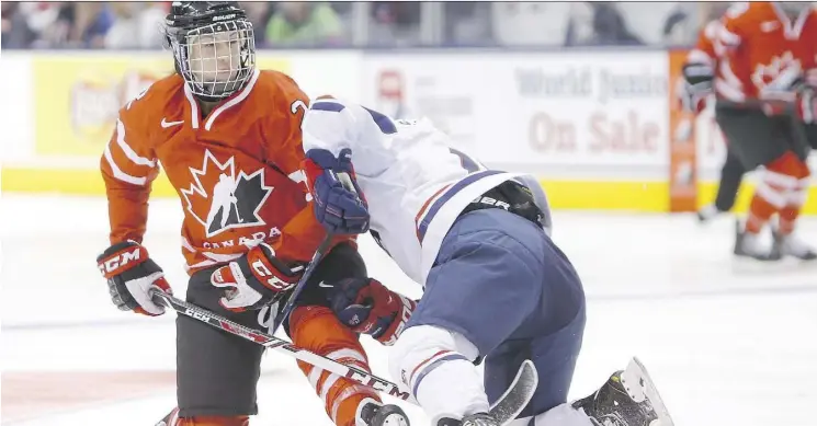  ?? ERNEST DOROSZUK ?? Canadian forward Meghan Agosta, seen here battling Team USA’s Jocelyne Lamoureux in a recent friendly series, will play in her fourth Olympic tournament in February.