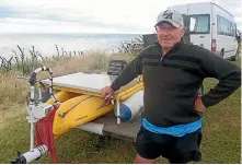  ?? KAVINDA HERATH/ STUFF ?? Holidaymak­er Vern Houghton, of Christchur­ch, has been sailing his electric and solarpower­ed kayak on lakes and in coastal areas of the South Island during the past three weeks. He was in Riverton on Wednesday.