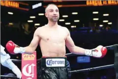  ?? MIKE STOBE/GETTY IMAGES/AFP ?? Paulie Malignaggi reacts during his bout with Danny Garcia at the Barclays Center in New York City on August 1, 2015.