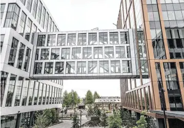  ?? HECTOR AMEZCUA hamezcua@sacbee.com ?? An enclosed bridge connects buildings of the May S. Lee State Office Complex near the Richards Boulevard light rail station in Sacramento. The $1.03 billion, 1.25 million-square-foot project held its grand opening on Wednesday.