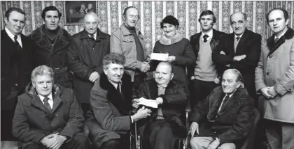  ??  ?? Mr. John Kelly, secretary of Killarney regatta committee, presents a cheque to Mr. Michael Fleming, chairman of Killarney Wheelchair Associatio­n, and Mr. Michael Fleming, treasurer, presents a cheque to Betty O’leary, accepting on behalf of the...