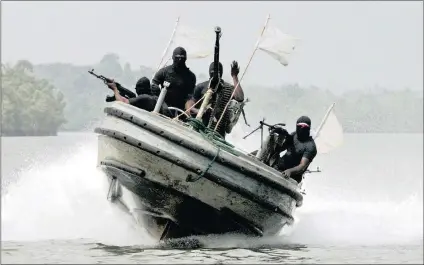  ?? PICTURE: REUTERS ?? Militants patrol the creeks of the Niger Delta region of Nigeria.