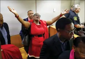  ?? TOM FOX/THE DALLAS MORNING NEWS VIA AP, POOL ?? Botham Jean’s mother, Allison Jean, rejoices in the courtroom after fired Dallas police Officer Amber Guyger was found guilty of murder, Tuesday, in Dallas. Guyger shot and killed Botham Jean, an unarmed 26-year-old neighbor in his own apartment last year. She told police she thought his apartment was her own and that he was an intruder.