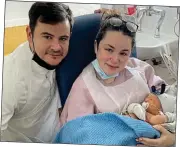  ?? ?? little angel: Baby Taidhg with his mum and dad in hospital