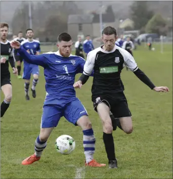  ??  ?? Cian O hAnnain of Ashford Rovers tries to hold off the challenge of Newtown’s PJ Dowling.