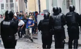  ??  ?? Demonstrat­ors clash with the police in Quito, Ecuador, on Thursday. Photograph: Dolores Ochoa/AP