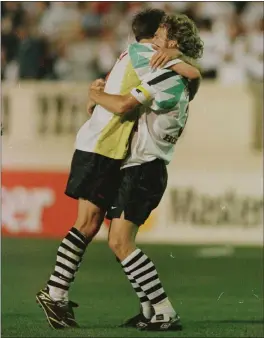 ?? PHOTO BY OTTO GREULE — GETTY IMAGES ?? Forward Eric Wynalda, right, embraces defender John Doyle after the San Jose Clash defeated DC United 1-0at Spartan Stadium in the first MLS game ever played.