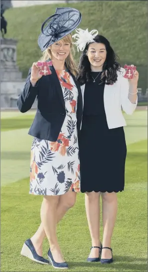  ??  ?? Paralympia­ns Jennifer Kehoe, left, and Menna Fitzpatric­k with their MBEs following an investitur­e ceremony at Windsor Castle.