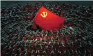  ??  ?? Performers dressed as rescue workers gather around the Communist party flag during a gala show ahead of the 100th anniversar­y of the founding of the Chinese Communist party in Beijing. Photograph: Ng Han Guan/AP