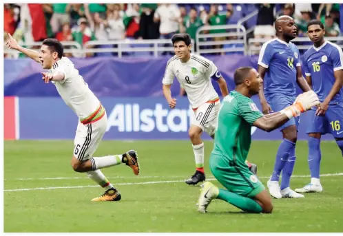  ??  ?? Mexico’s Edson Alvarez, left, celebrates his goal against Curacao during a CONCACAF Gold Cup soccer match Sunday. (AP)