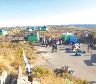  ?? (Garin Yehuda) ?? SETTLERS SET up tents in an attempt to create a new outpost on the outskirts of the Gush Etzion Region of the West Bank last week.