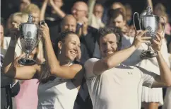  ??  ?? 0 Nicole Melichar and Alexander Peya with their trophies.