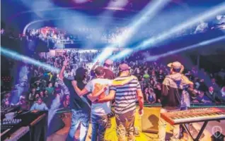  ??  ?? Members of Sunsquabi, Dynohunter, Break Science and Late Night Radio take a bow after a show at the Ogden Theatre on Nov. 23. Provided by Cait Falc