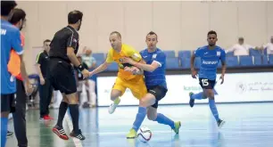  ?? Supplied photo ?? Players battle for the ball during a futsal match in the NAS Ramadan Tournament. —