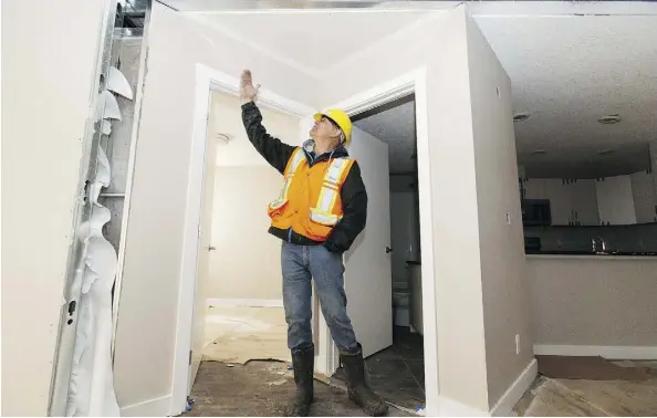  ??  ?? Larry Slywka gives a tour of Westgate Manor, an apartment developmen­t on 163 Street that uses shipping containers for constructi­on.