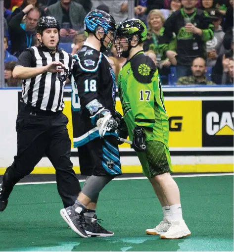  ?? KAYLE NEIS ?? Rochester Knighthawk­s defender Jake Withers, left, connects helmets with Rush forward Robert Church while an official moves in during Saturday’s game at Sasktel Centre. In the rematch of last season’s National Lacrosse League finalists, the Rush came out 12-7 winners.