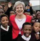 ??  ?? Theresa May at a Cape Town school