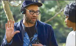  ?? AP ?? Writer-director and producer Jordan Peele instructs actress Betty Gabriel on the set of ‘Get Out.’