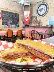  ?? STAFF PHOTO BY ANNE BRALY ?? Cuban sandwiches are the top seller on Rum Cake Lady’s menu.