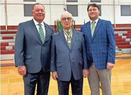  ?? JOSEPH SCHWARTZBU­RT/THE SAVANNAH MORNING NEWS ?? 2024 Grand Marshal for Savannah’s St. Patrick’s Day parade, John Forbes, left, poses with his father, Jim Forbes, and son, Conor Forbes during the Grand Marshal announceme­nt on Sunday at Benedictin­e Military School.